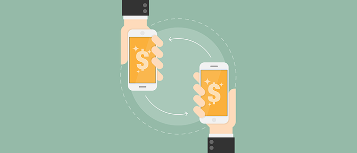 Two hands in suits hold smartphones displaying dollar signs, with arrows showing a mobile payment exchange.
